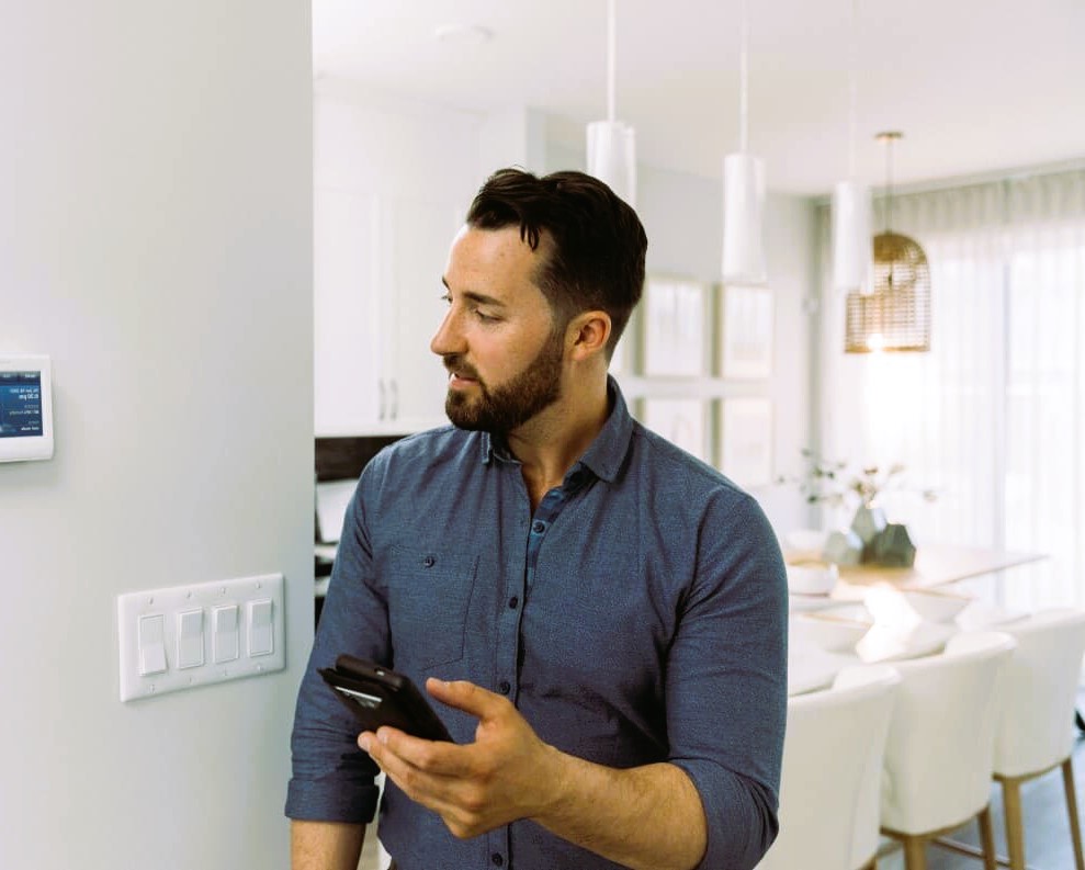 Man using his phone to control his smart home